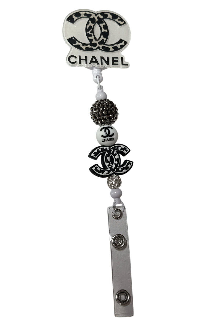 Cc Chanel beaded badge reel