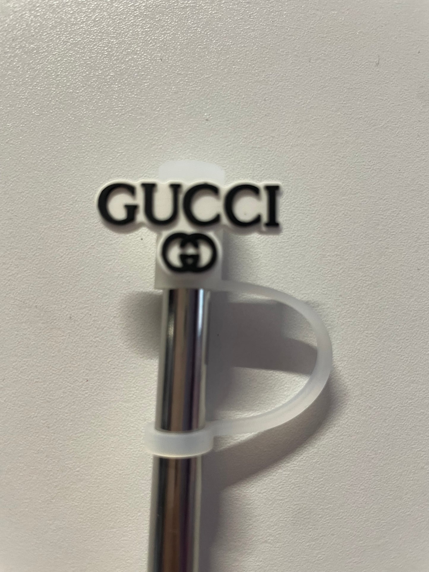 Gucci sign under Straw Topper