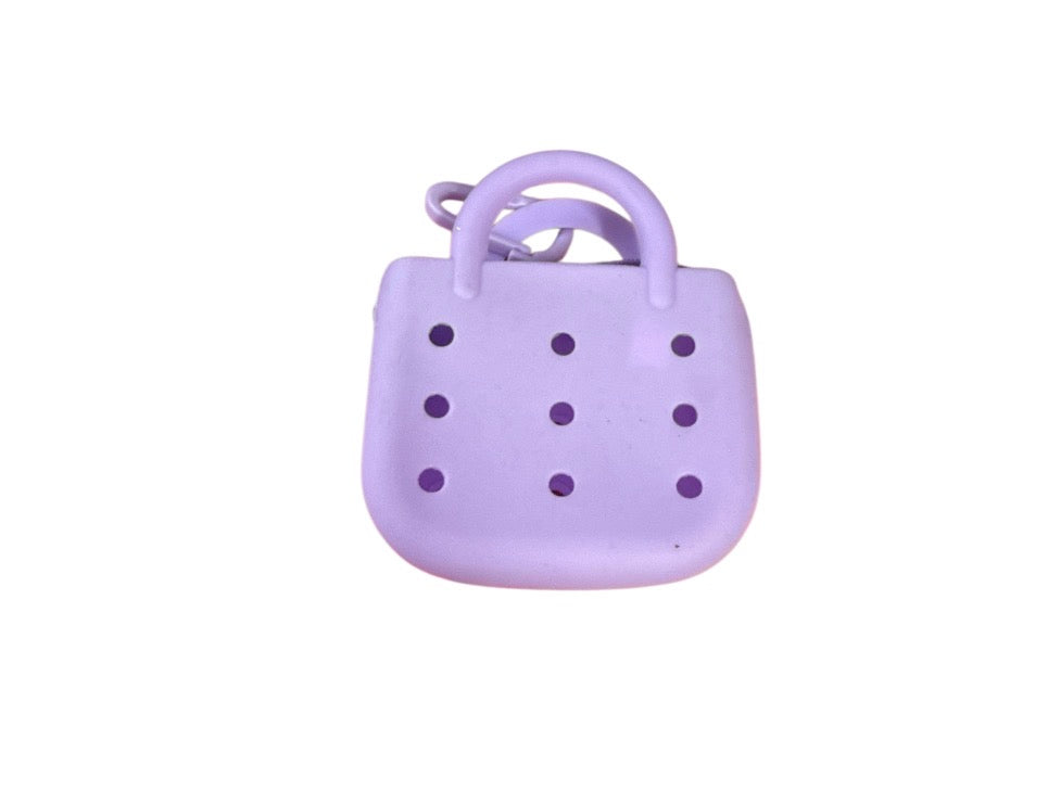 Small rubber charm purse with 3 free mystery charms