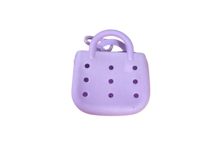 Small rubber charm purse with 3 free mystery charms