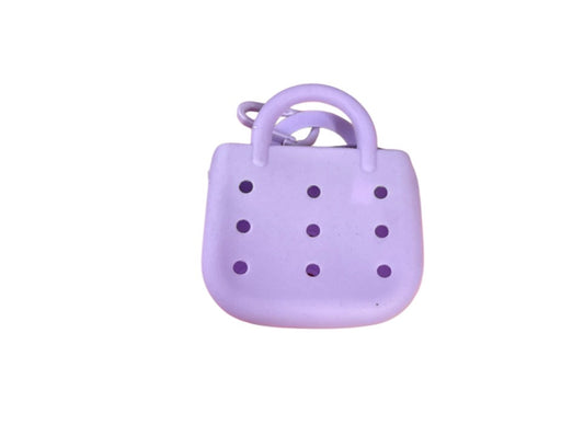 Small rubber charm purse with 3 free mystery charms